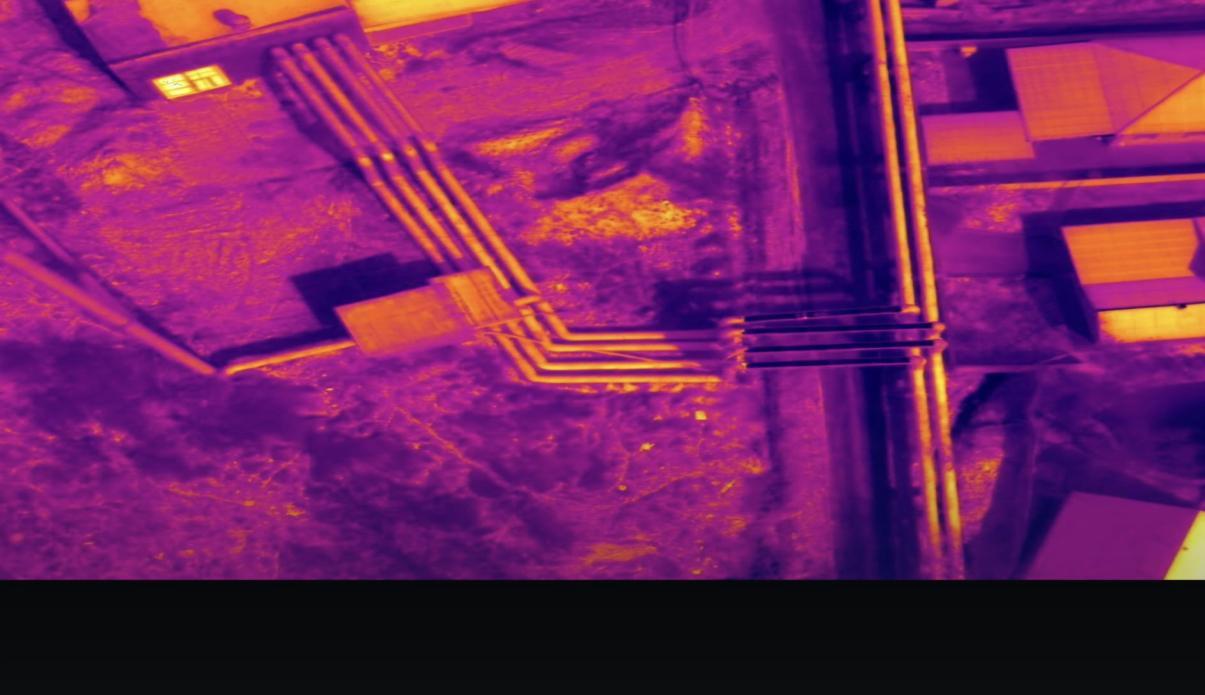Aerial thermogram with pipe routes visible through the ground